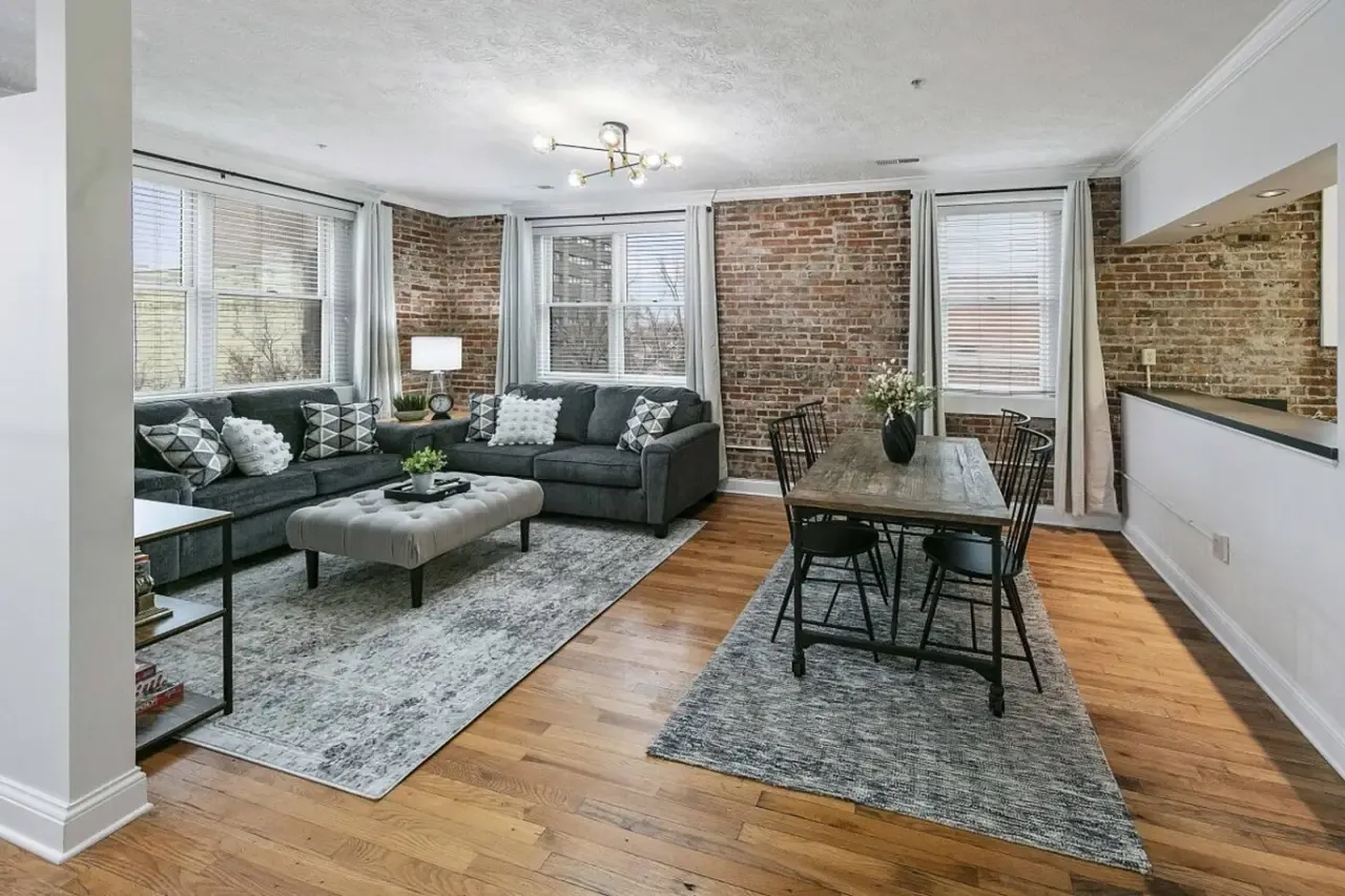 Living and dining area with exposed brick in Bricks Over Broadway