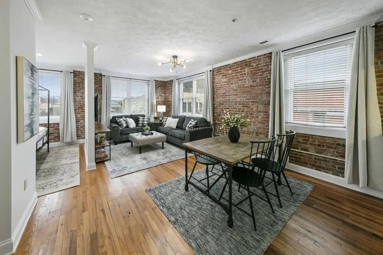 Dining table and Broadway-facing windows in Bricks Over Broadway