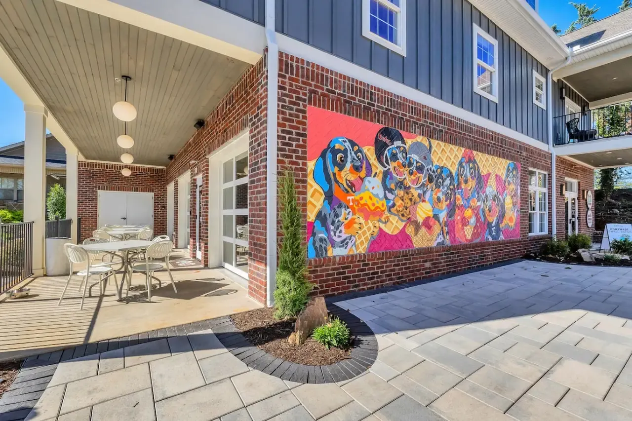 Colorful mural and outdoor seating at Greenway Village