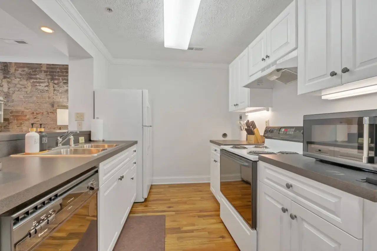 Kitchen with white cabinets in Perch Over Pistol Creek