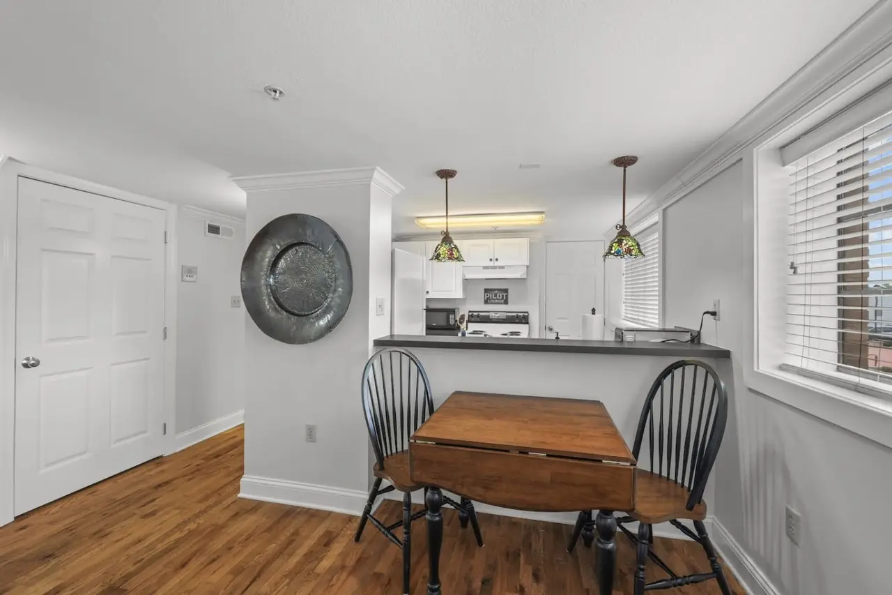Kitchen, dining table, and laundry at The Landing